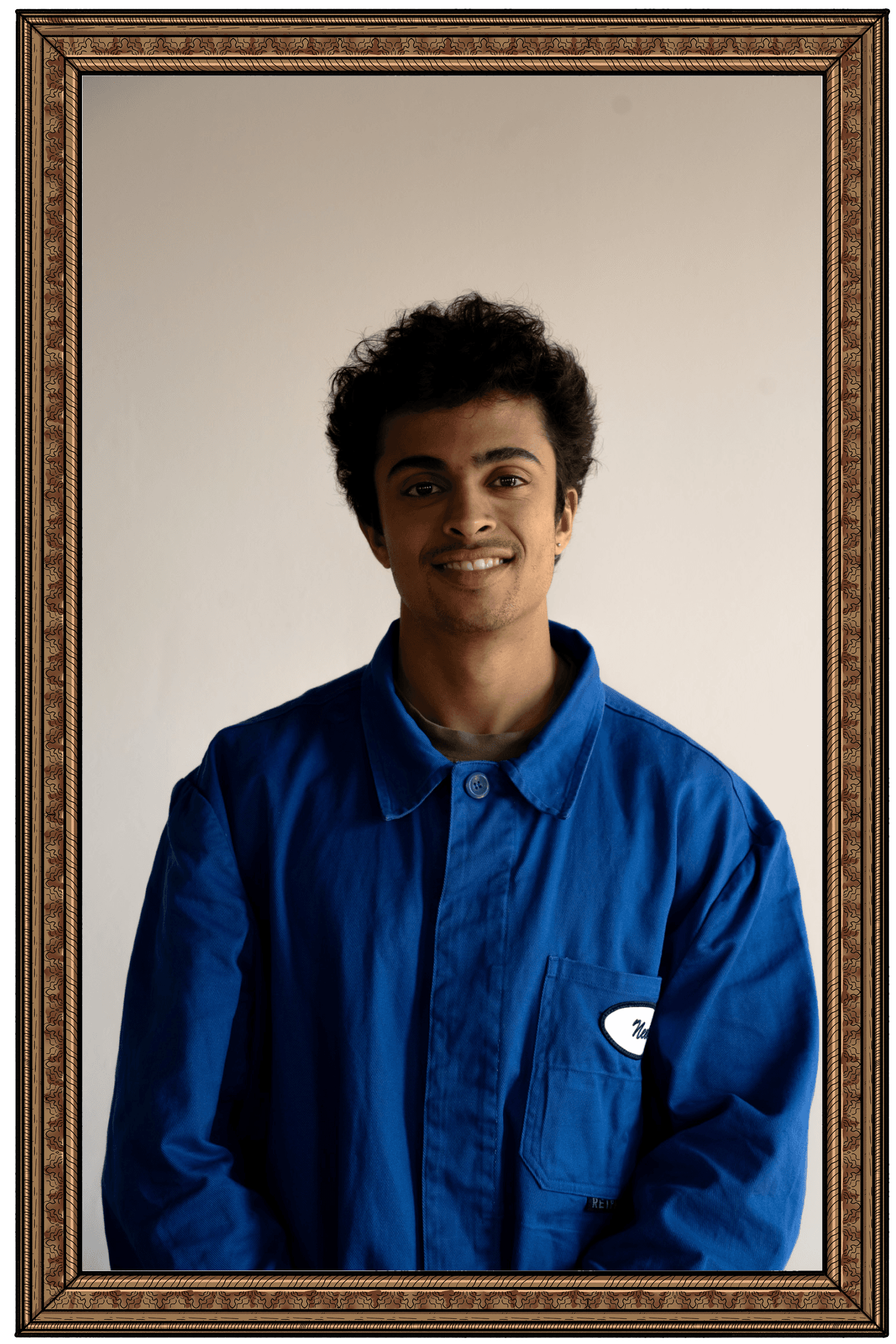 Neel Khare in ornate frame